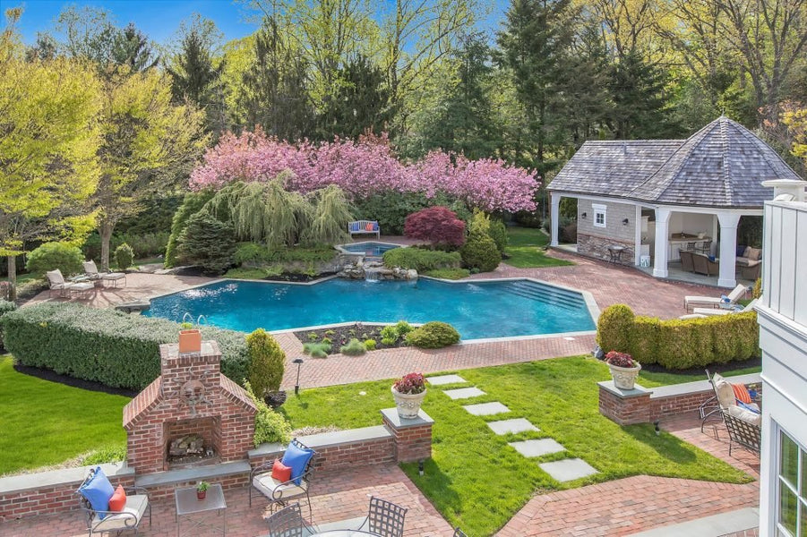 $8.75M Long Island mansion comes with a Go-Kart track, beach volleyball court, pool waterfall, and more