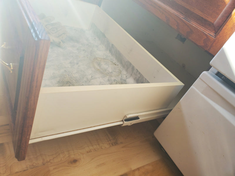 How can I release these drawer slides?