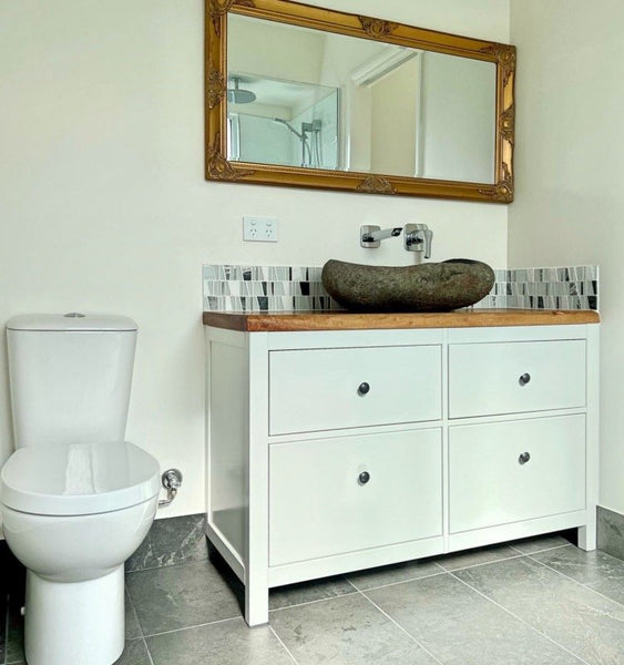 Stunning bathroom vanity with wood slab top and stone basin